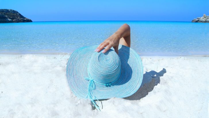 Woman lies on the beach